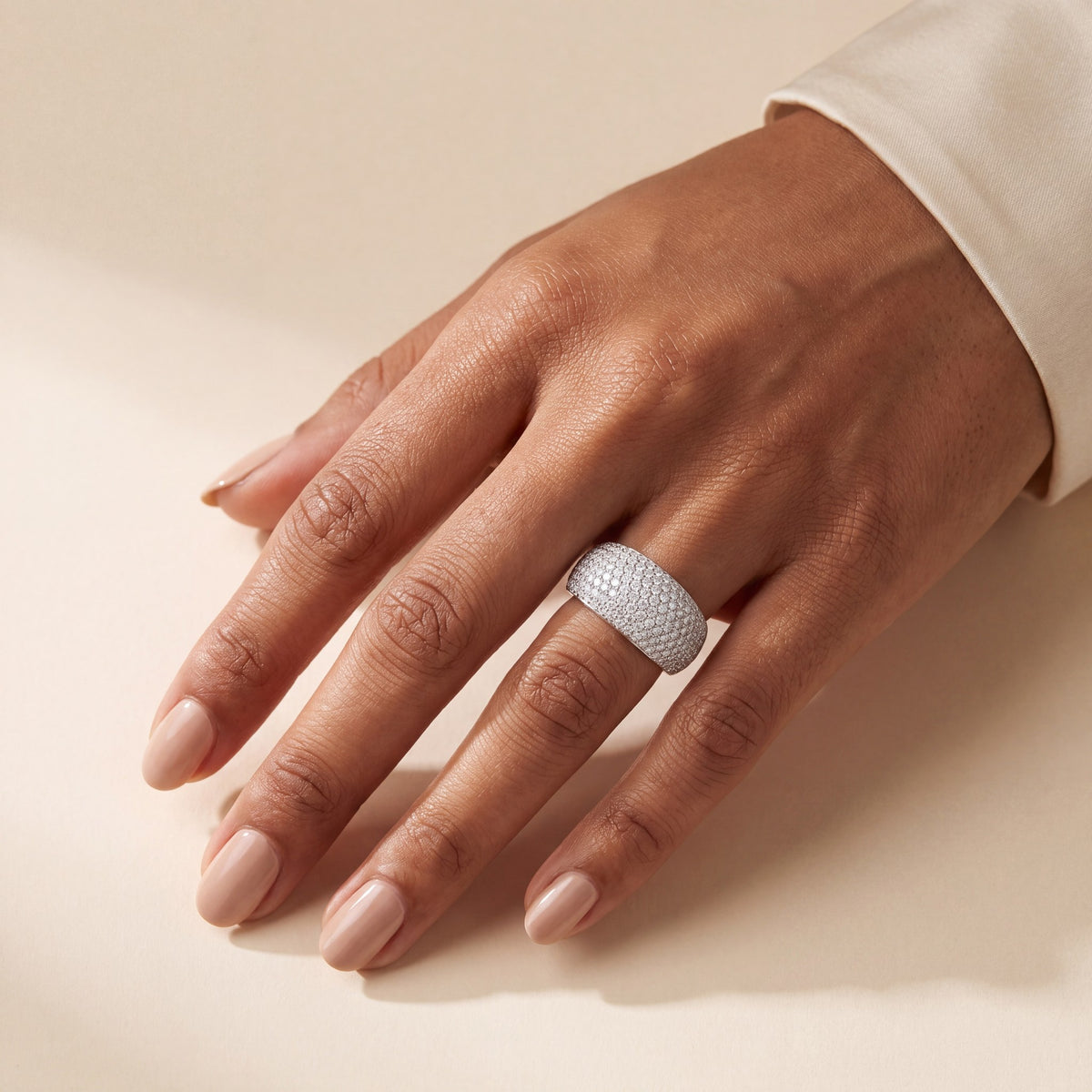 Pavé dome ring worn on the ring finger