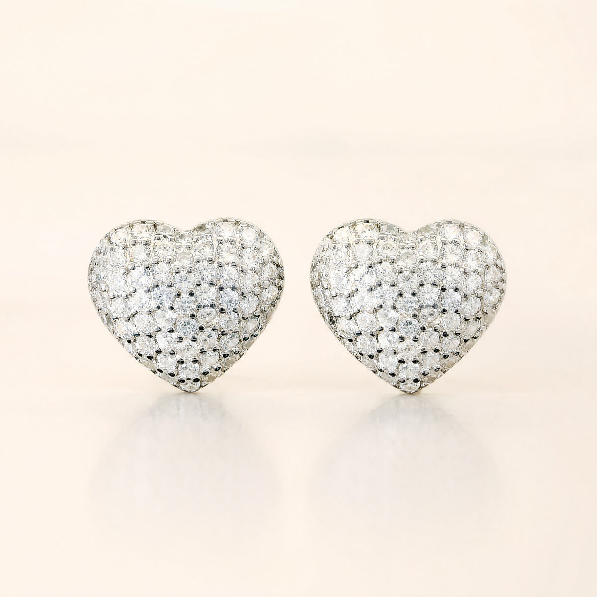 Pair of sterling silver pavé heart stud earrings