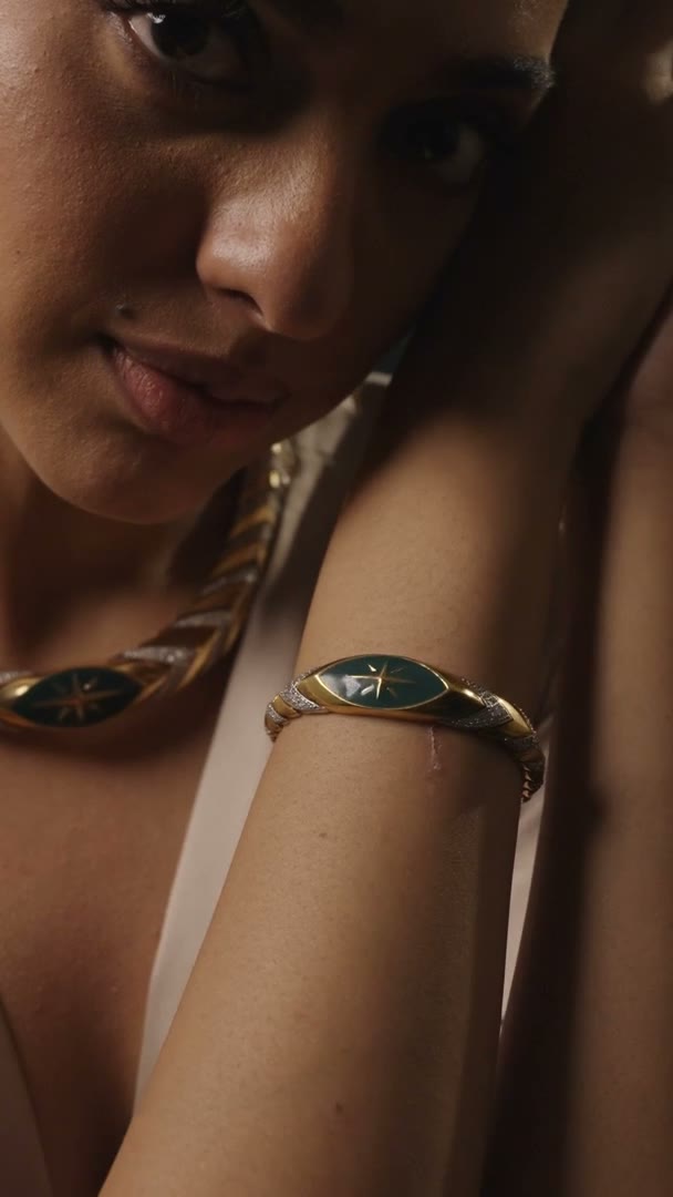 A woman wearing a Zoci necklace and earrings